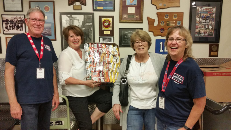 Dee delivering CDRW's donations to  the Sea-Tac USO.