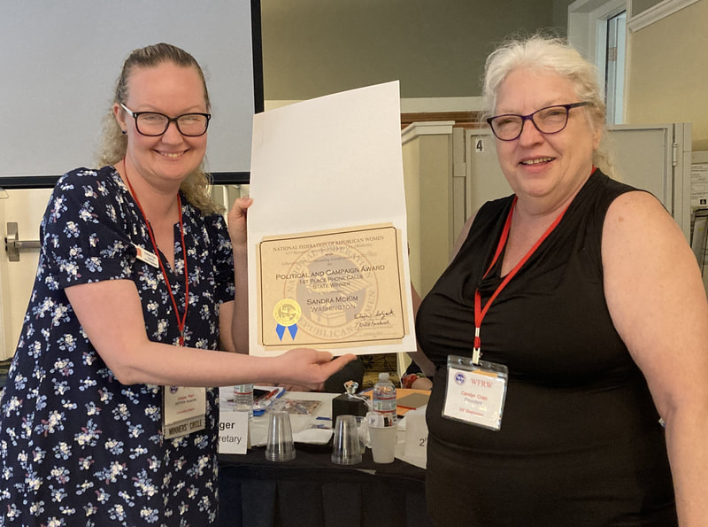 Carolyn Crain accepted an award for Sandra McKim for NFRW's  Political and Campaign Award.  
